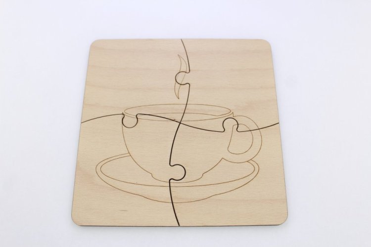 Podtácek ve tvaru puzzle s čajem - vektorový